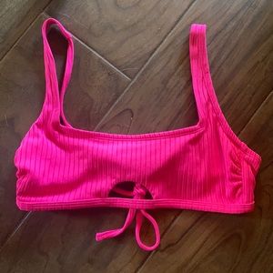Neon pink keyhole cutout bikini top from Target.